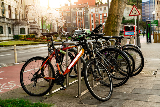 Bicycle at bike station for rent to travel or transport in the city. Sustainable travel. Bicycle sharing system. Bicycle for city tour at bike parking station. Eco-friendly transport. Urban transport.