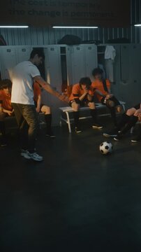 Sports Mentor Leads Briefing, Expressing Anger, Providing Feedback to Teenage Football Squad. Sports Psychology, Character Building, Challenging Path of Youth Athlete Development. Vertical Shot.