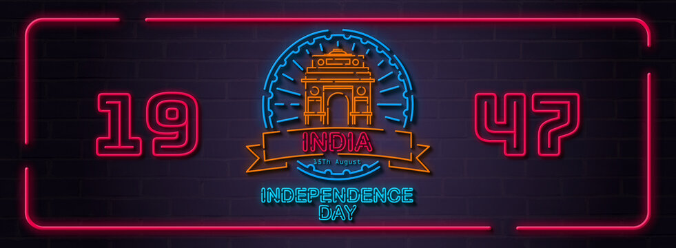 India Independence Day horizontal neon sign banner on dark brick wall featuring India Gate, 1947 typography, and blue wheel circle. Perfect for patriotic web headers, social media covers.