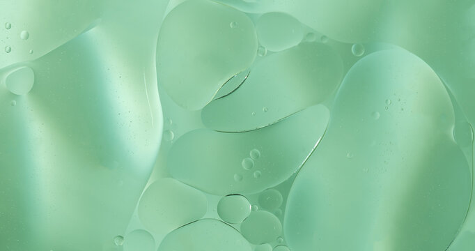 Abstract Green water bubbles essential oil beauty collagen Serum Repair cell background.