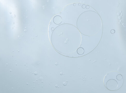 Abstract Blue water bubbles essential oil beauty collagen Serum Repair cell background.