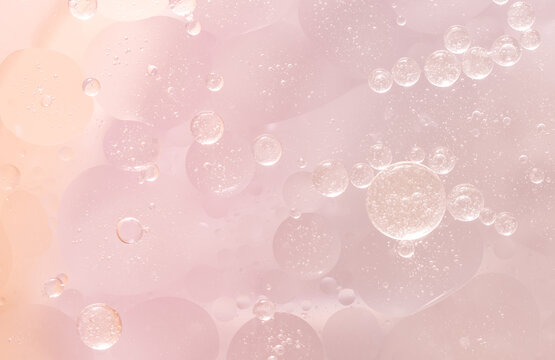 Abstract Pink water bubbles essential oil beauty collagen Serum Repair cell background.