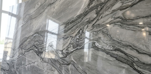 Natural grey marble stone wall with striking veining pattern and finish high end background polished luxurious abstract architecture interior © Manjur
