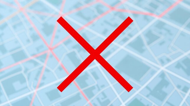 Red cross mark on blurred city map