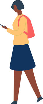 Young woman walking with a backpack while checking her smartphone