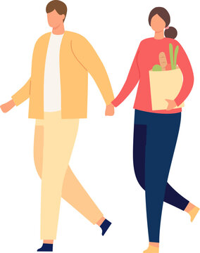 Couple holding hands, walking together after grocery shopping with fresh produce