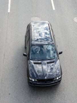 Black BMW X5 E53 first generation SUV photographed from above highlighting classic luxury vehicle design and automotive heritage
