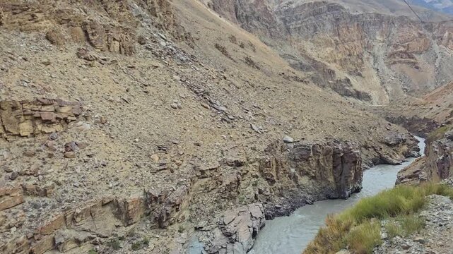 Mountain Roads Between Rocks and Green Slopes