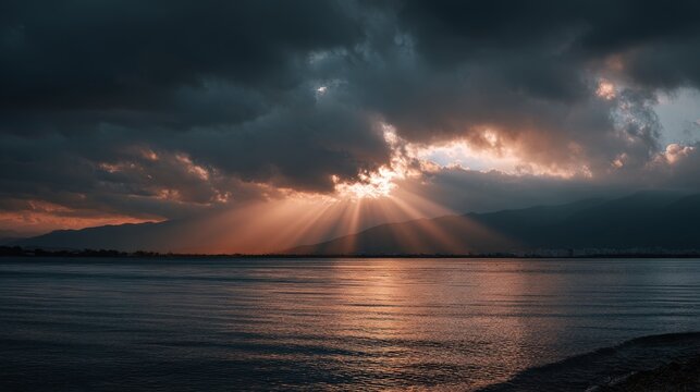 beautiful sea view with dramatic sunset, sun rays shining through the clouds