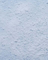 Fototapeta premium Vertical clean snow texture background white winter surface post