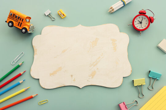 Back to school concept over pastel background. Top view