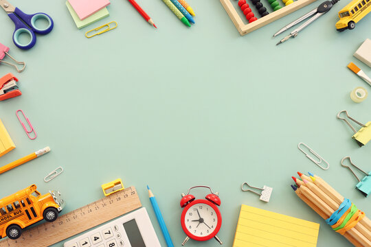 Back to school concept over pastel background. Top view