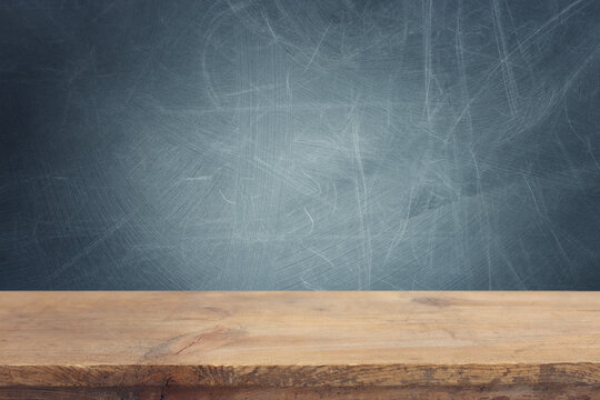 Empty table and chalkboard background