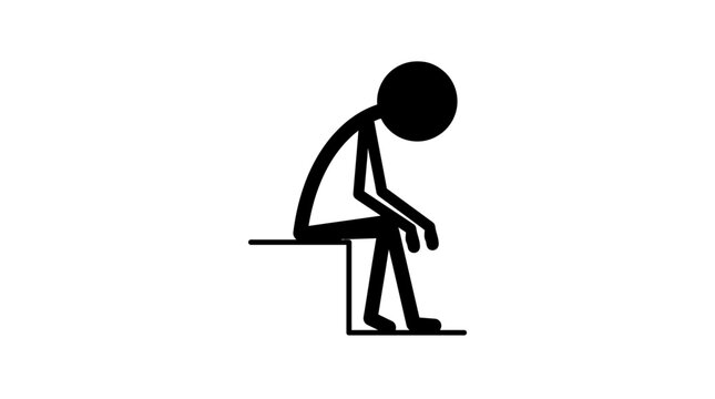 A person sitting on a bench looking down.