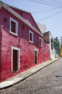 Red colonial house on a cobblestone street corner, Olinda, Pernambuco, Brazil
