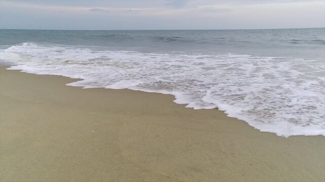 Surf washes up on an Atlantic coast beach.