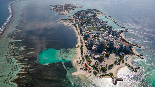Aerial drone view of Maafushi, one of the inhabited islands of Kaafu Atoll in the Maldives. Maafushi island is popular for budget travel in Maldives.