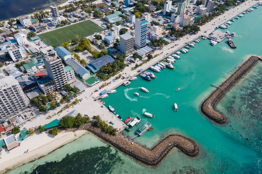 Aerial drone view of Maafushi, one of the inhabited islands of Kaafu Atoll in the Maldives. Maafushi island is popular for budget travel in Maldives.
