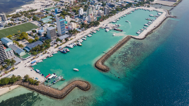 Aerial drone view of Maafushi, one of the inhabited islands of Kaafu Atoll in the Maldives. Maafushi island is popular for budget travel in Maldives.