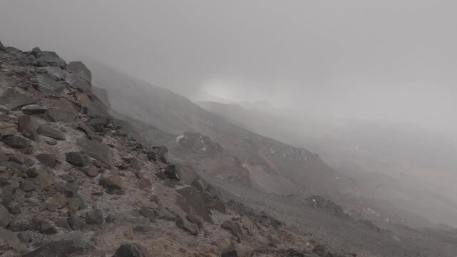 View of Mount Little Ararat from the slope of Mount Greater Ararat in snow and bad weather, Turkey