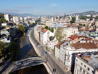 Obraz premium Historic Latin Bridge over the Miljacka River and Sarajevo Cityscape in Bosnia and Herzegovina