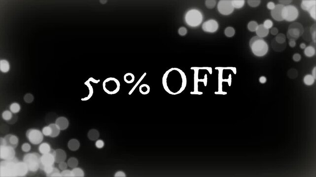 Sale advertisement displays fifty percent off text with blurred white bokeh lights.