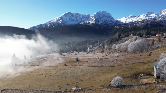 Drone View of Zabljak City in Montenegro During Winter with Foggy Valley