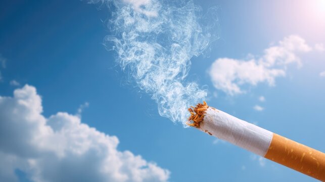 Bright blue sky with bold smoke-free atmosphere, foreground broken cigarette