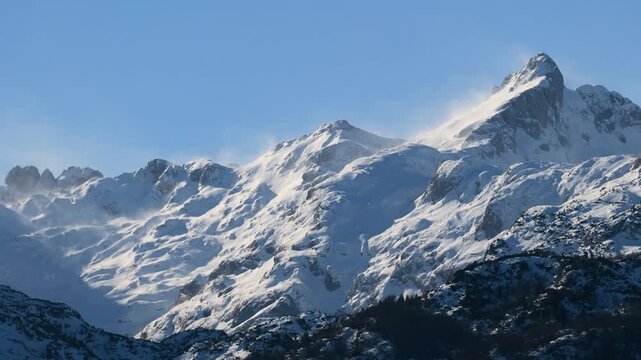 Winter Mountain Landscape Time Lapse with Strong Winds Blowing Snow Across Snow Covered Peaks