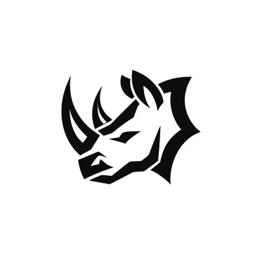 Strong rhino head profile icon with sharp geometric details for sports mascot or modern emblem branding in solid black graphic style.