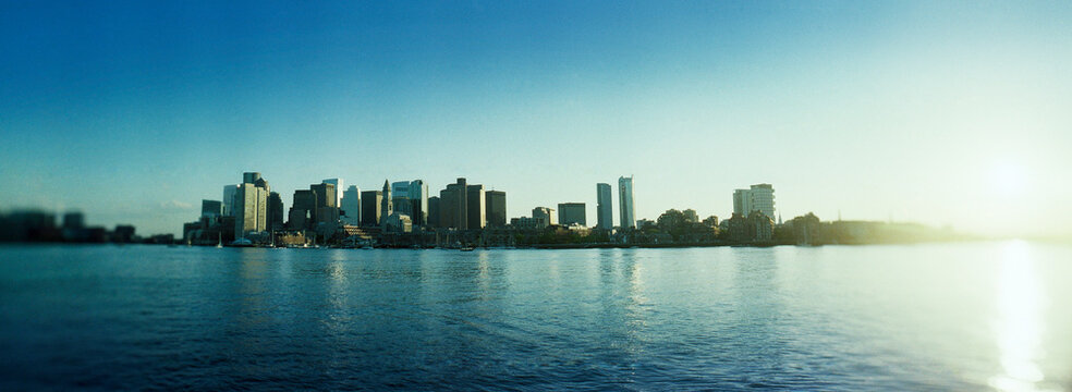 Scenic panoramic view of the Boston skyline and downtown financial district as viewed across the Boston Harbor., Boston, Massachusetts, New England, United States