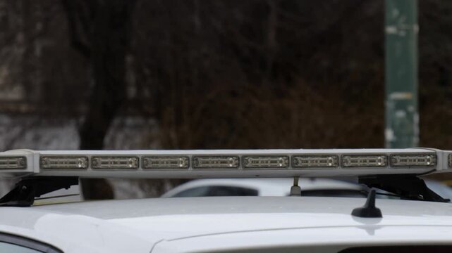 Close-Up of Flashing Blue and Red Emergency Lights on Police Car, Law Enforcement Vehicle in Action