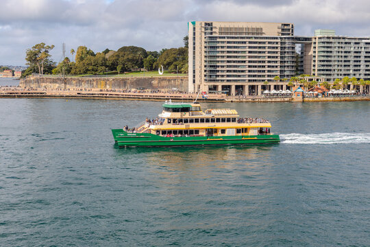 7 July 2026 Sydney Ferry Passing in front of Sydney Opera house with its beautiful white buildings and blue sky Sydney NSW Australia