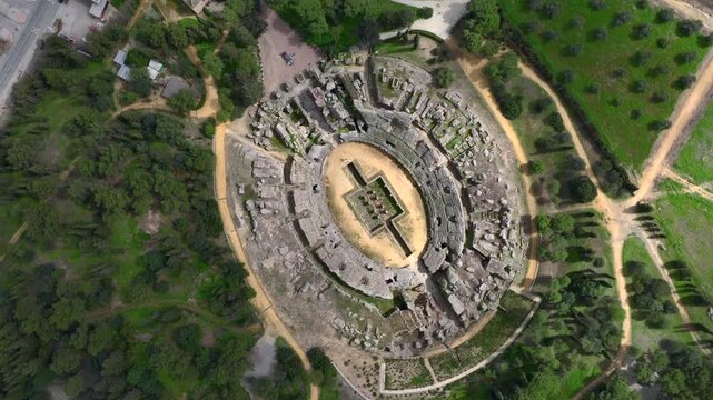 Aerial Drone view of the Amphitheatre of the Roman city of Italica, Ancient Ruins near to Seville, Sevilla, Spain