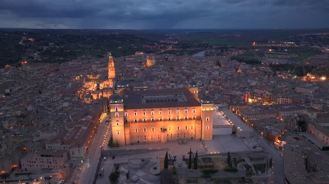 Aerial night view of the historic Toledo, Illuminated medieval city with Alcazar of Toledo Castilla-La Mancha, Spain.