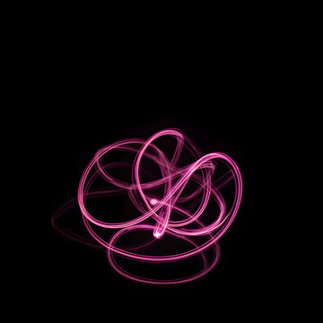 Glowing pink light trails on black background