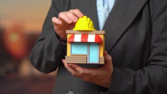 A woman puts on a construction worker's hard hat at a store. Business expansion. Retail growth, commercial property, real estate investments, urban development, and market strategies
