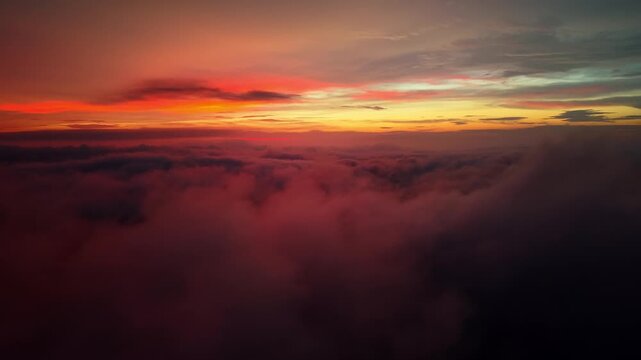 Aerial View of Red Cloud Sea and Orange Sunset Skyline, No Ground Visible