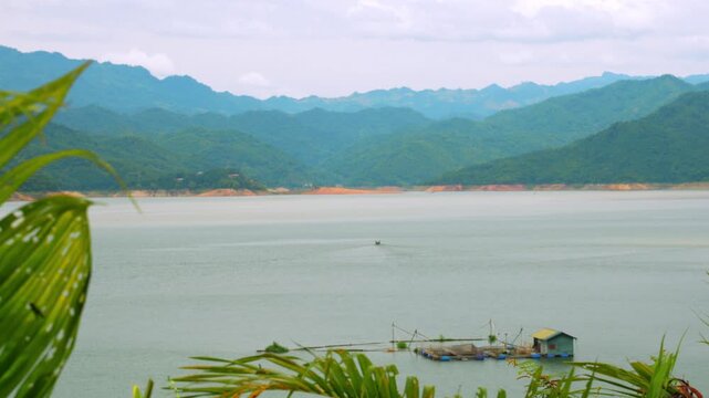 Boat journey through Ngoi Hoa Bay between karst mountains, Hoa Binh, Vietnam