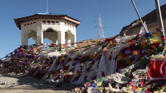 Leh Ladakh India Prayer flags floating in the wind, Leh Ladakh, North India. Buddhist prayer flags fluttering in the wind on the way to Kargil Kashmir. Tibetan Peace Flags Flying On A Hill Top.