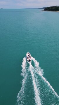 Aerial View of Speedboat Leaving Wake on Turquoise Sea