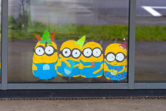 Primary school building with minions paintings at Swiss village of NIederglatt on a gray autumn day. Photo taken December 14th, 2025, Zurich Niederhasli, Switzerland.
