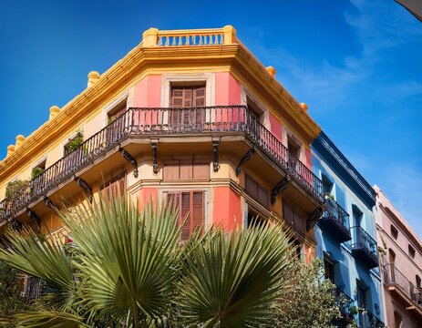 traditional spanish balcony and colorful facades in poble espanyol barcelona a vibrant corner showcasing colorful mediterranean facades traditional wooden balconies and palm trees