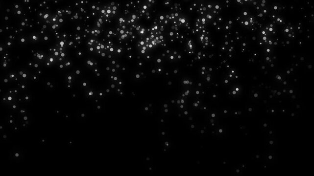 White dynamic dots fall down on a black screen.