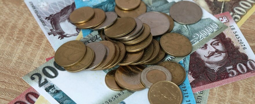Hungarian forint money bills and coins on table. Hungary cash of HUF currency close up