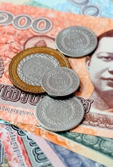 Cambodian riel money bills and coins on table. Cambodia cash of KHR currency © Larysa