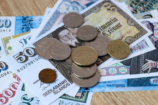 Icelandic krona money bills and coins on table. Iceland cash of ISK currency close up