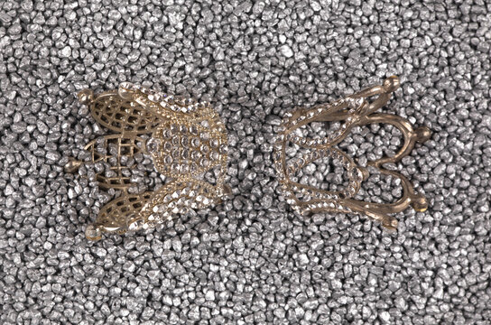jewelry crown isolated on silver sand