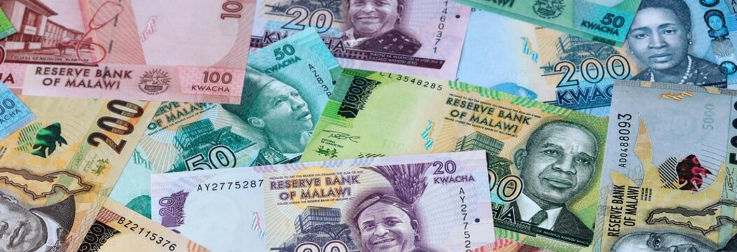Malawian kwacha money banknotes bunch on table. Malawi bills of MWK currency