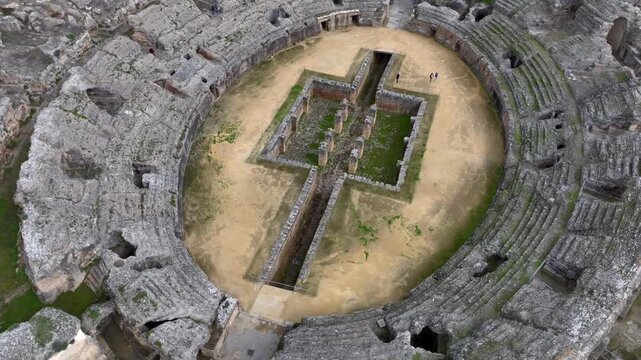 Aerial Drone view of the Amphitheatre of the Roman city of Italica, Ancient Ruins near to Seville, Sevilla, Spain